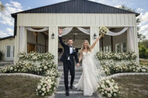 The Waterside Ranch - Bride and Groom at Main Hall Doors