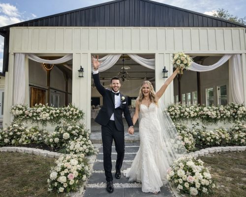 The Waterside Ranch - Bride and Groom at Main Hall Doors